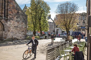 People walking past the Holy Trinity Church