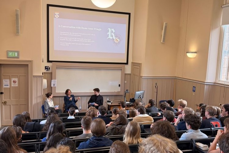 Student sitting in a lecture theatre during a conversation with the University of St Andrews' Chancellor, Dame Anne Pringle.