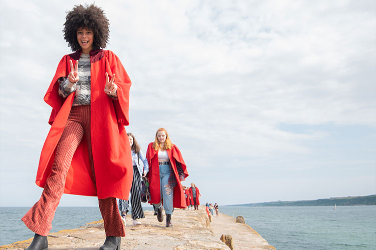 Students walking on the pier