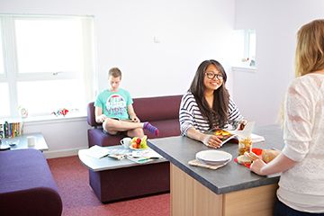 Students chatting inside University accommodation