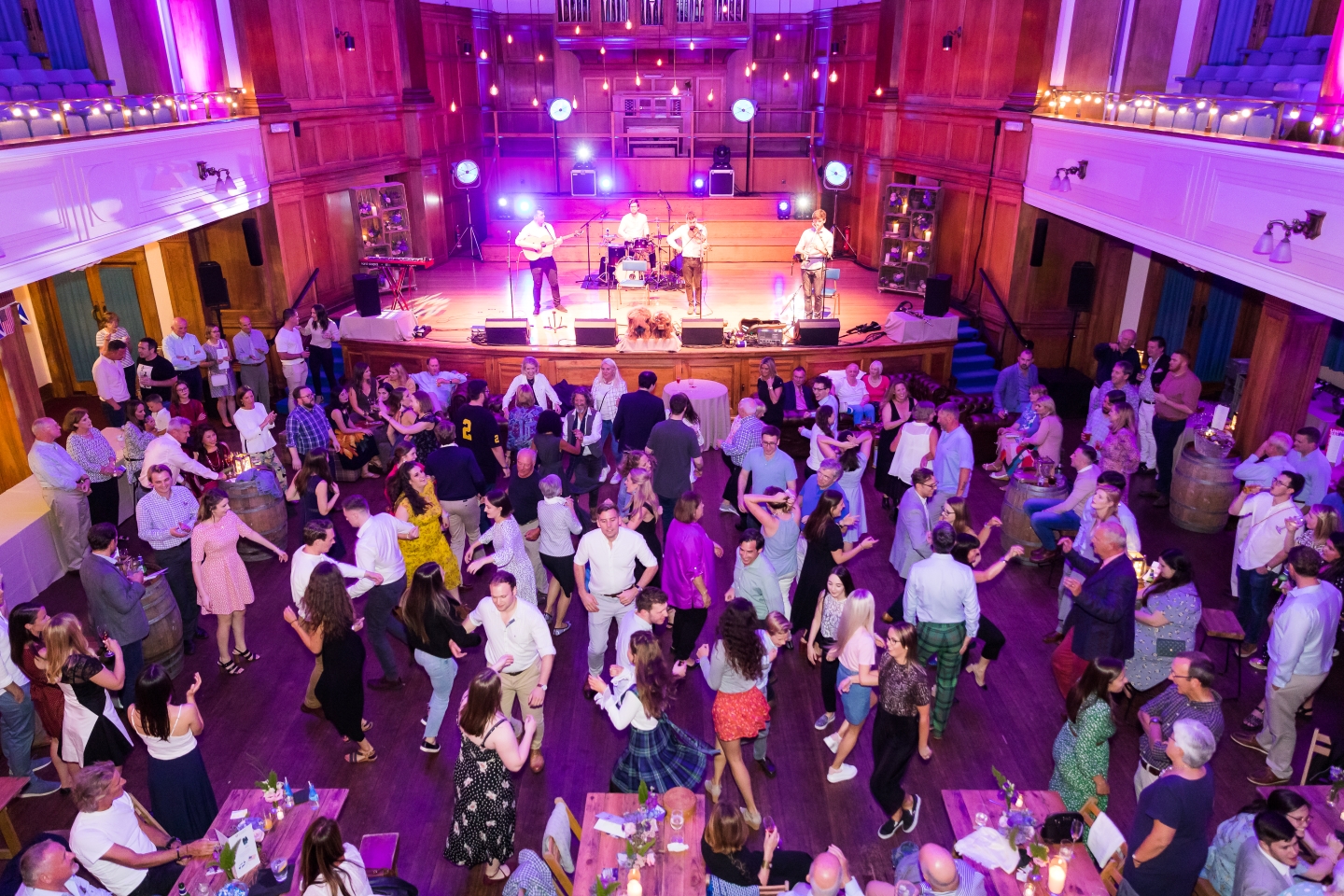 Guests dancing at a themed event in Younger Hall
