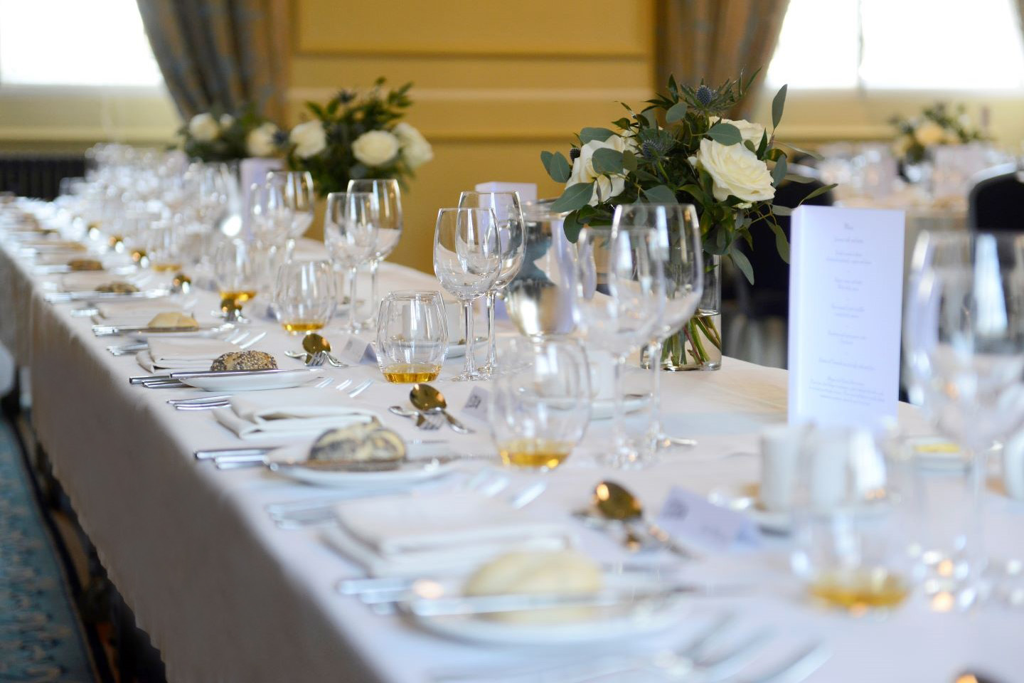 Close up of top table in Lower College Hall
