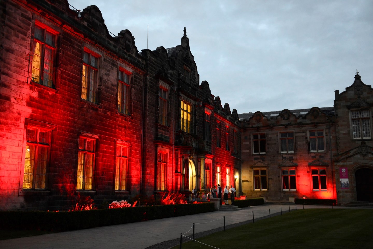 Exterior of Upper College Hall with lights
