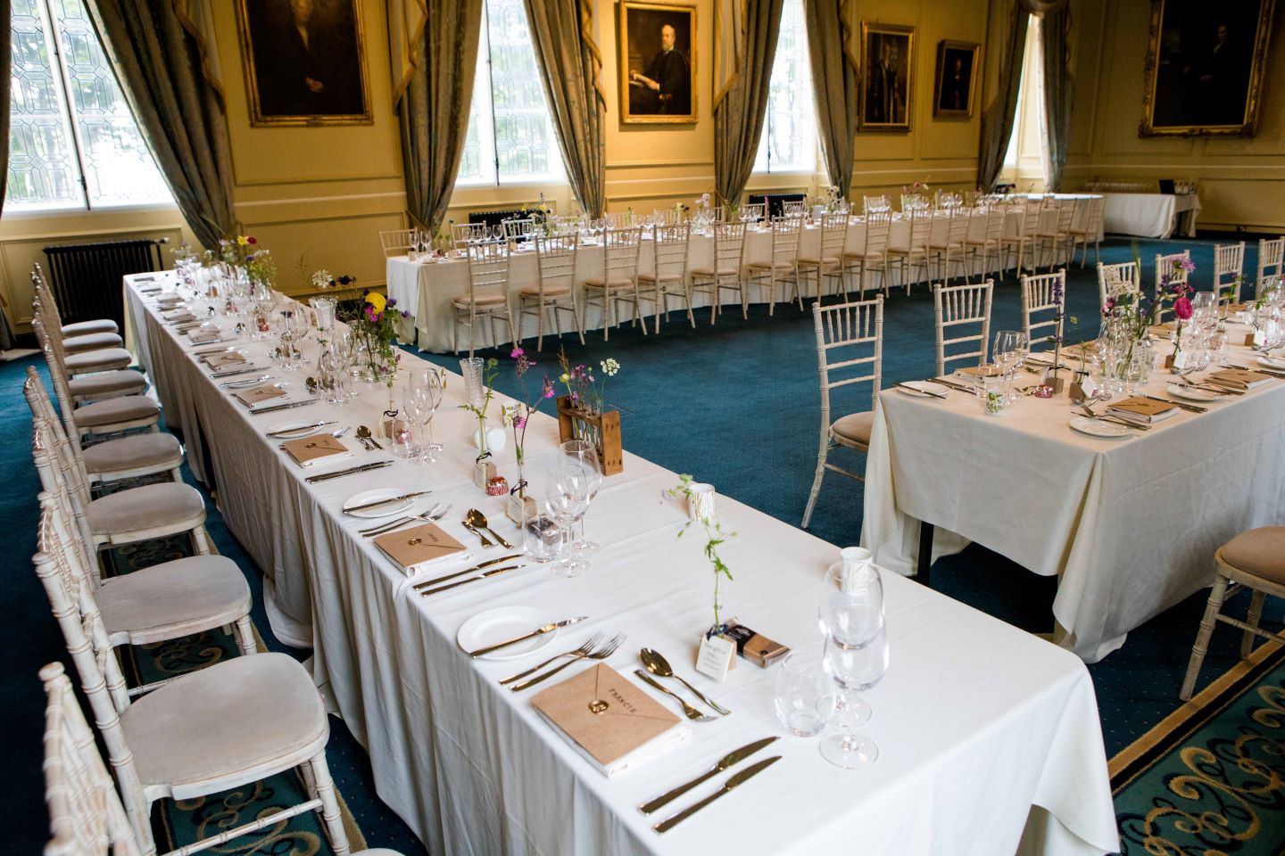 Long tables set for wedding breakfast in Lower College Hall