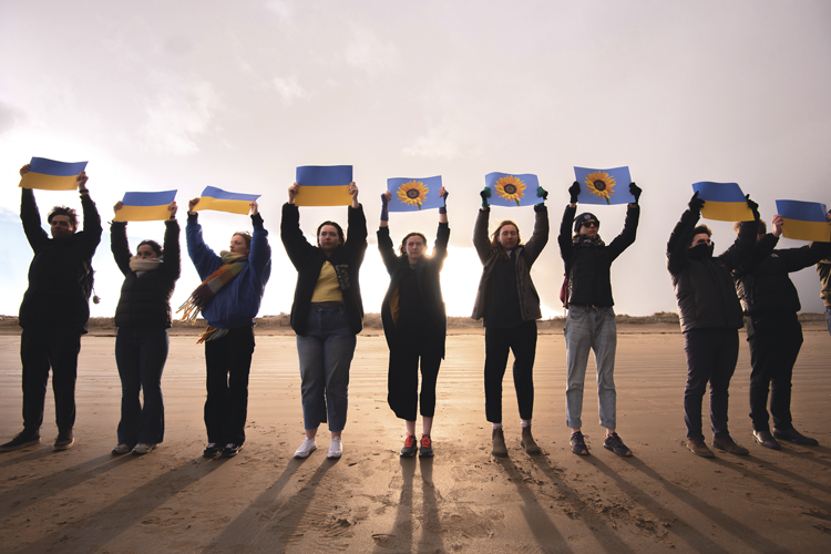 group holding Ukraine flags in the air