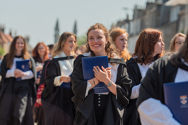 Parade of students in graduation robes