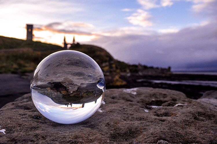 lensball on pier at dusk