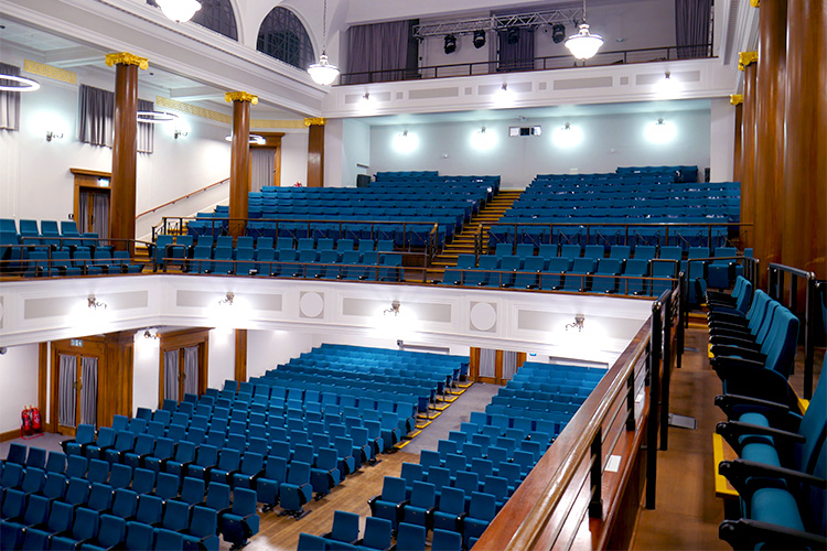 Blue seats in lecture hall