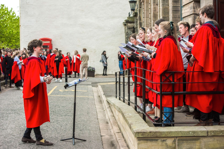 Chapel choir performing outside of Younger Hall, St Andrews