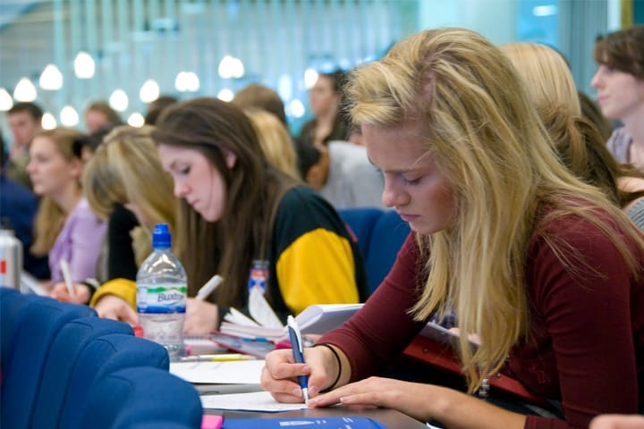 Students taking notes in a lecture