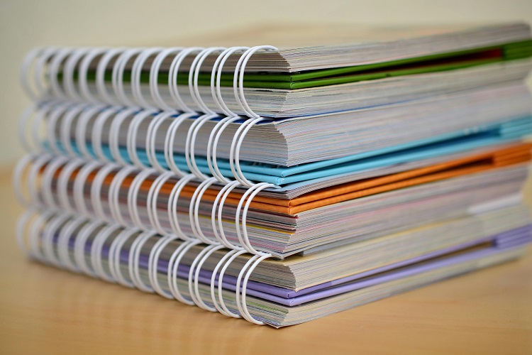 A close-up of some bound textbooks