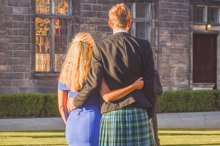 A couple holding each other around the waist