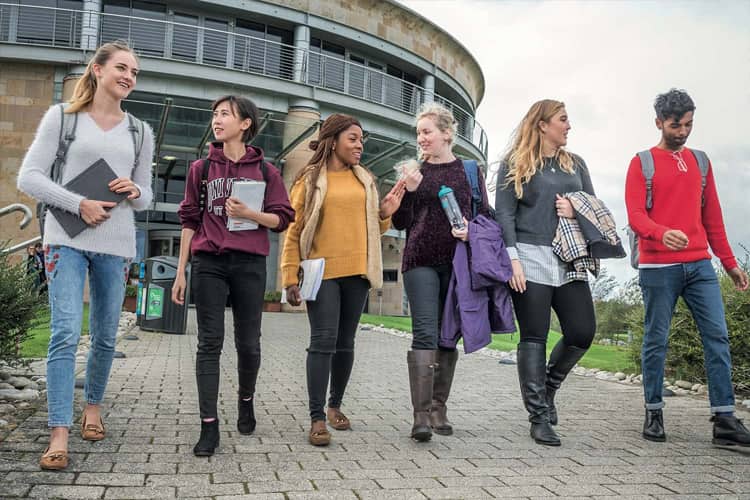 Students at the gateway building