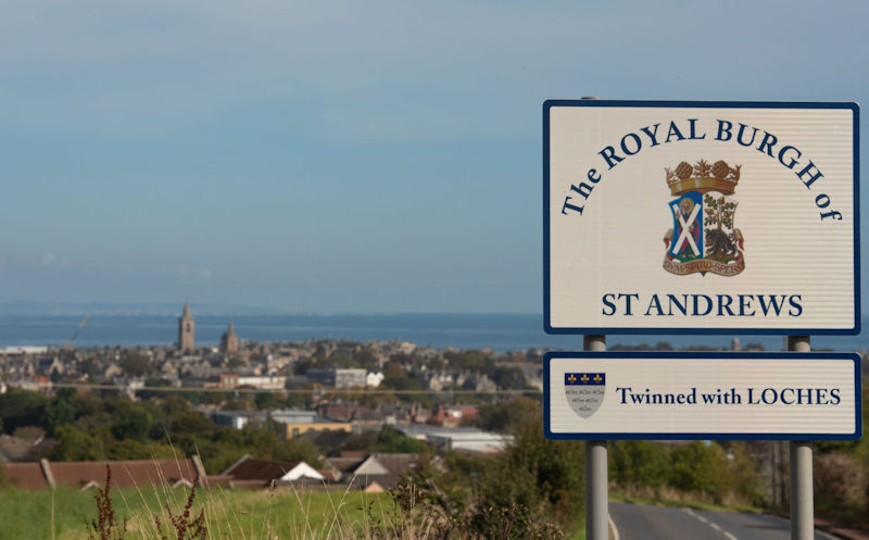 The Royal Burgh of St Andrews sign with the town in the distance