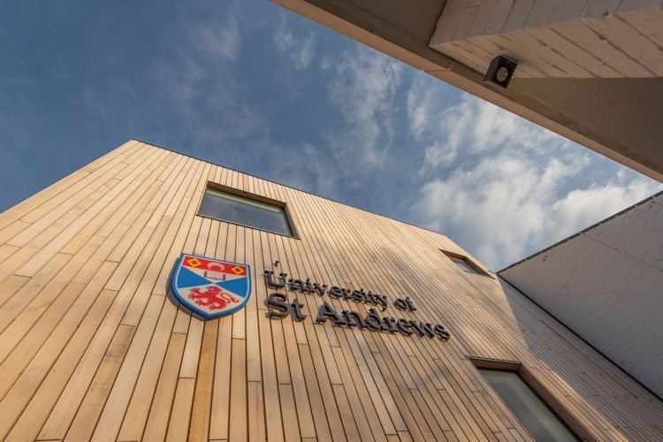 University of St Andrews sign on a wooden external wall