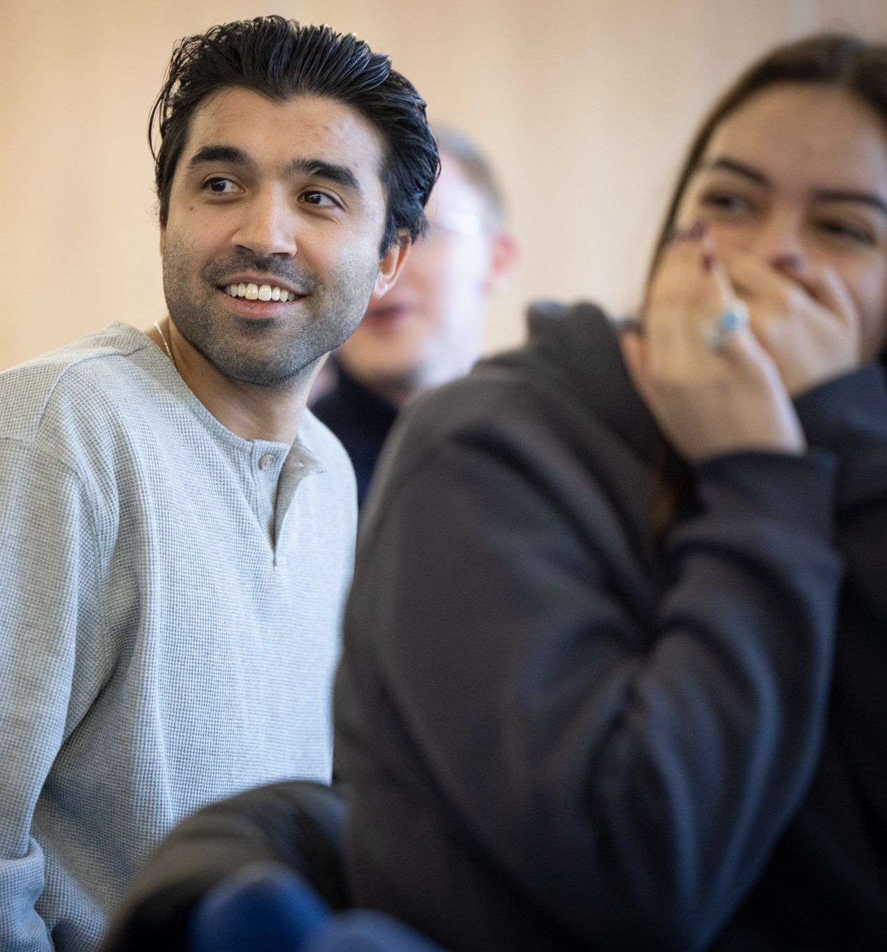 students in class smiling and laughing