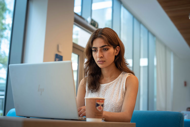 Woman studying on a laptop