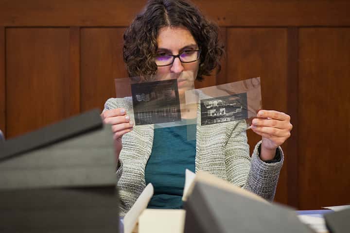 St Andrews researcher comparing photographic negatives