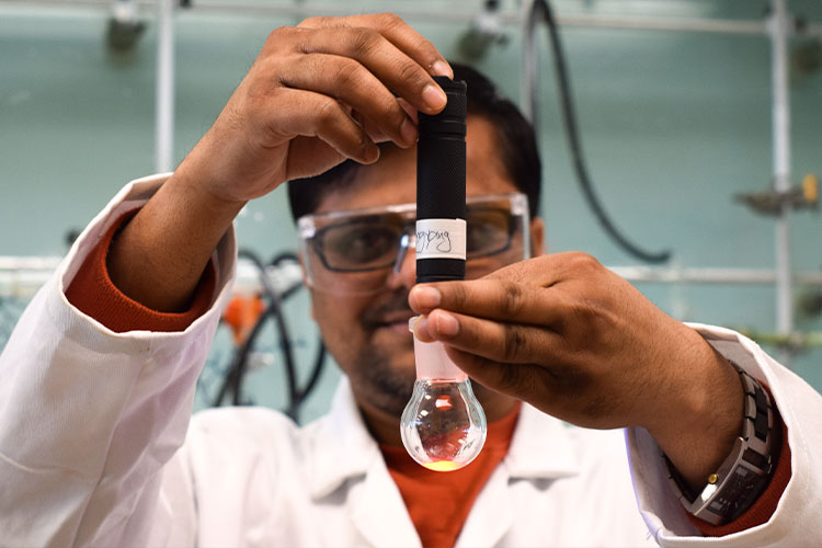 Lab student with bulb