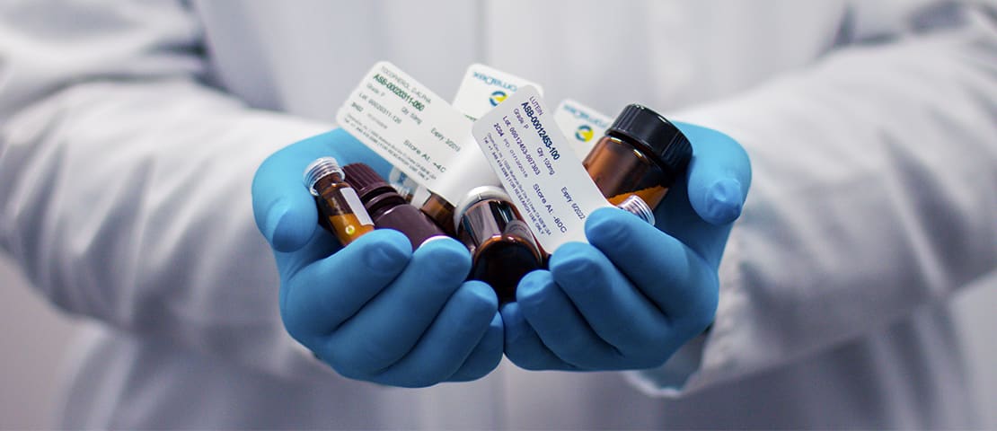 Holding bottles of pharmaceuticals