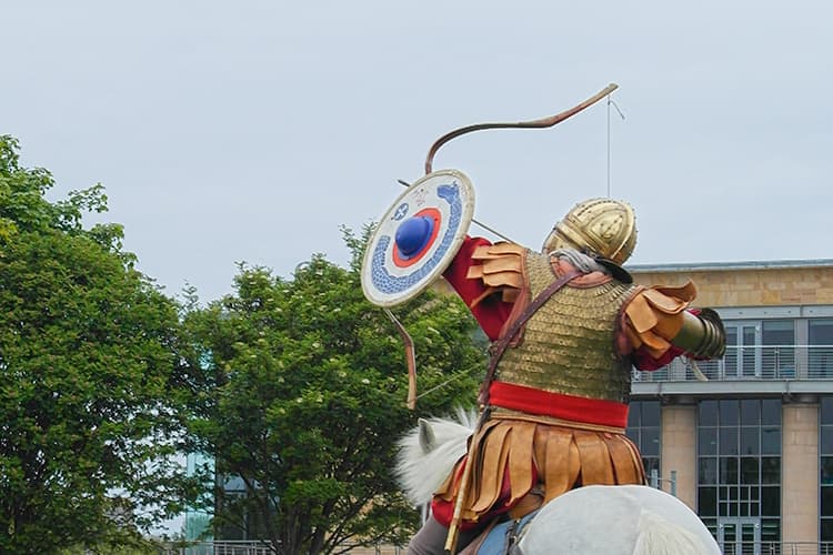 horseman shooting arrow upwards to the sky