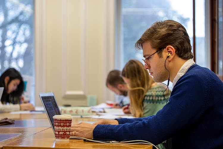 Three people studying