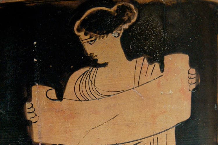 Woman reading from a scroll
