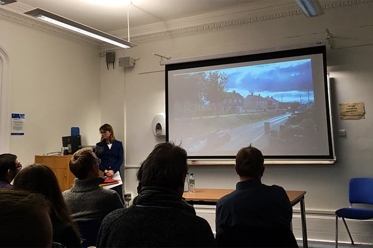 People sitting listening to a classics seminar