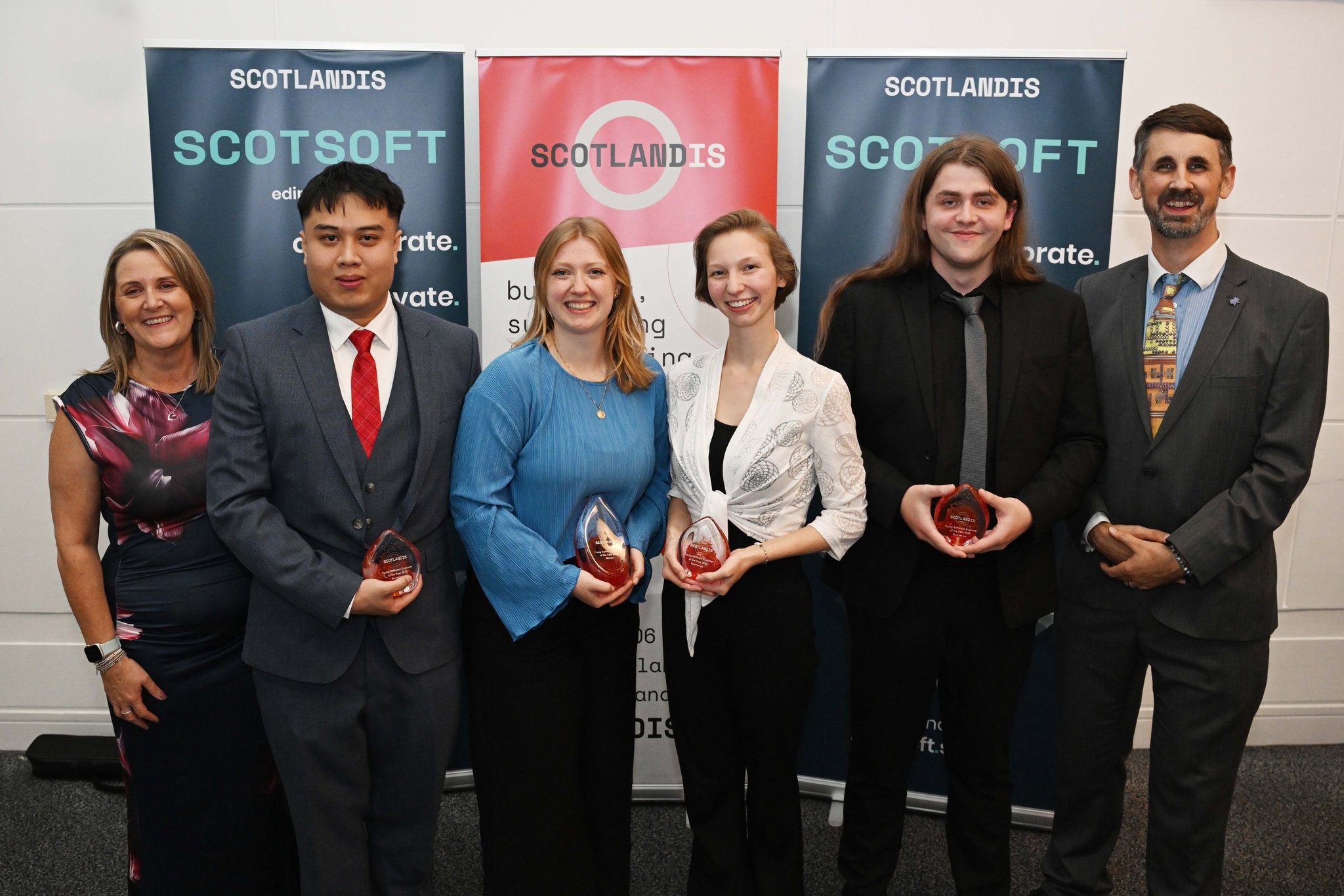 Award winners holding their trophies