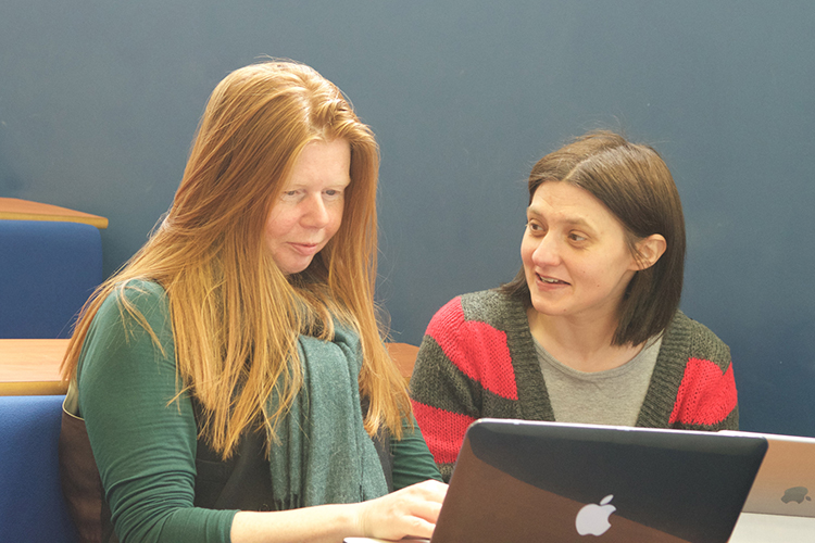 Two academic staff in discussion