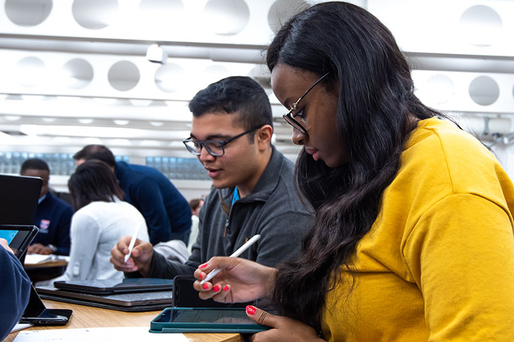 Two students working together in the lab