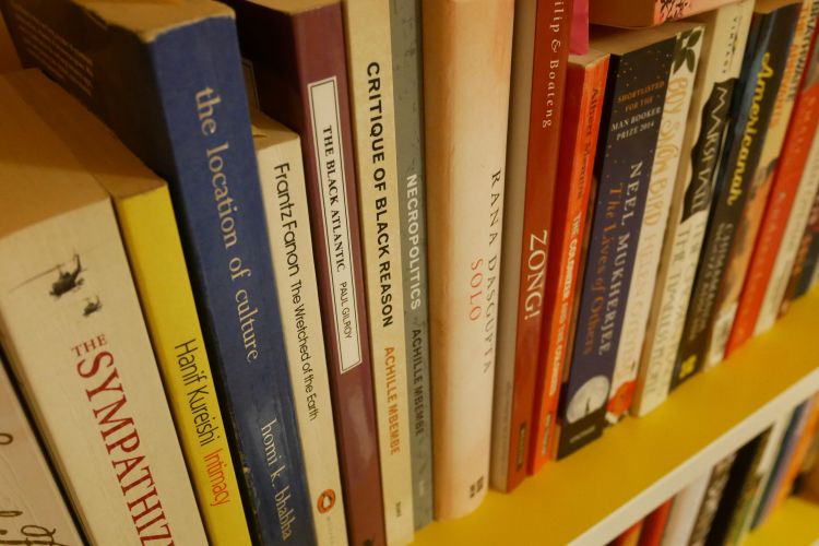 Diverse literature on a bookshelf
