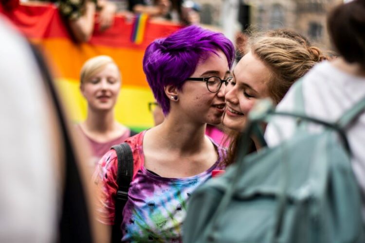 Two women kissing