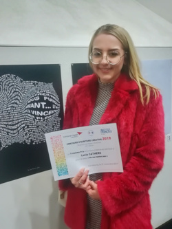 Lucia Cathers holding the certificate 