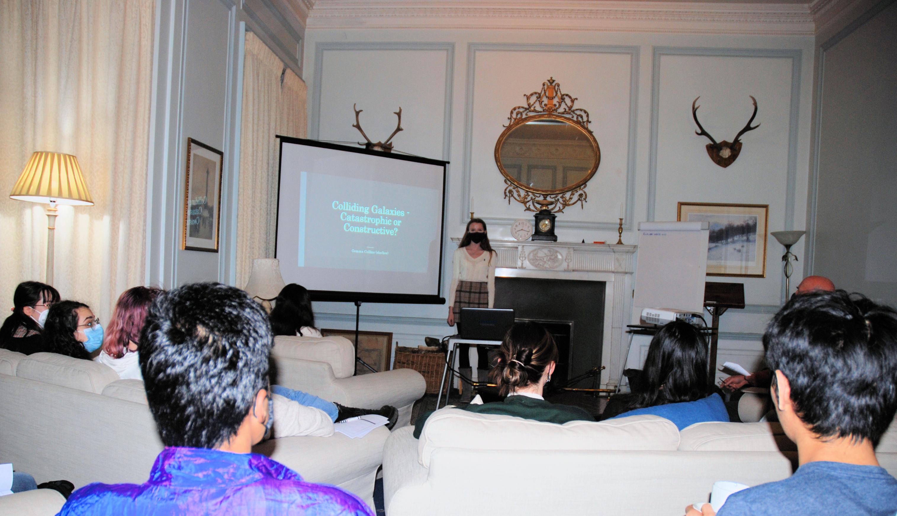 Student giving a talk at the Burns conference.