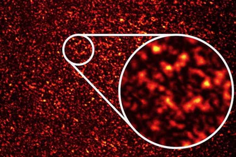 Image of a speckle pattern, light and dark regions on a photograph.