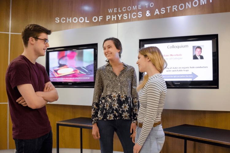 Three students in the School of Physics and Astronomy. © Tricia Malley Ross Gillespie.