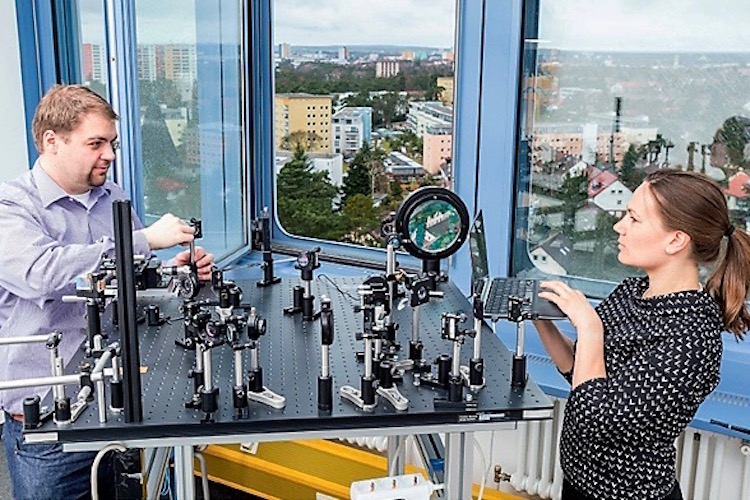 Two scientists setting up a quantum communication.