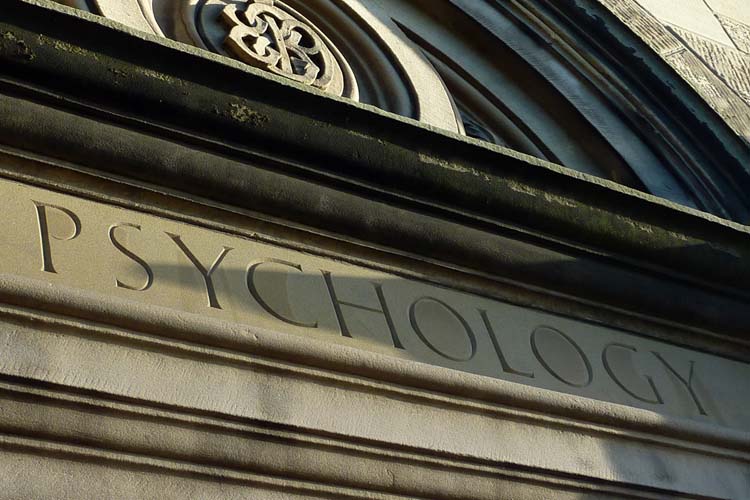 The word psychology carved in stone above the building entrance.