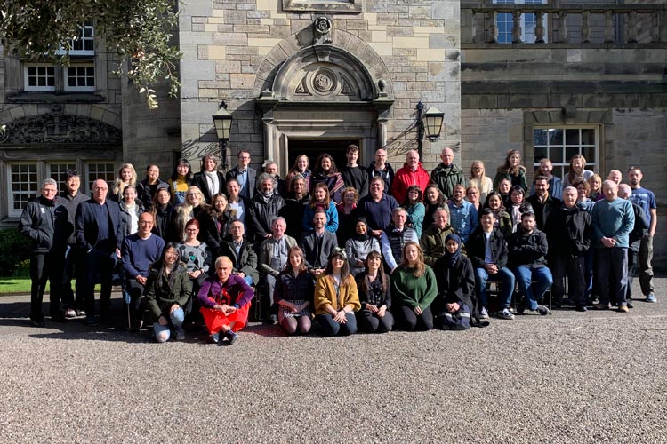 staff and postgraduate students outside the Psychology building