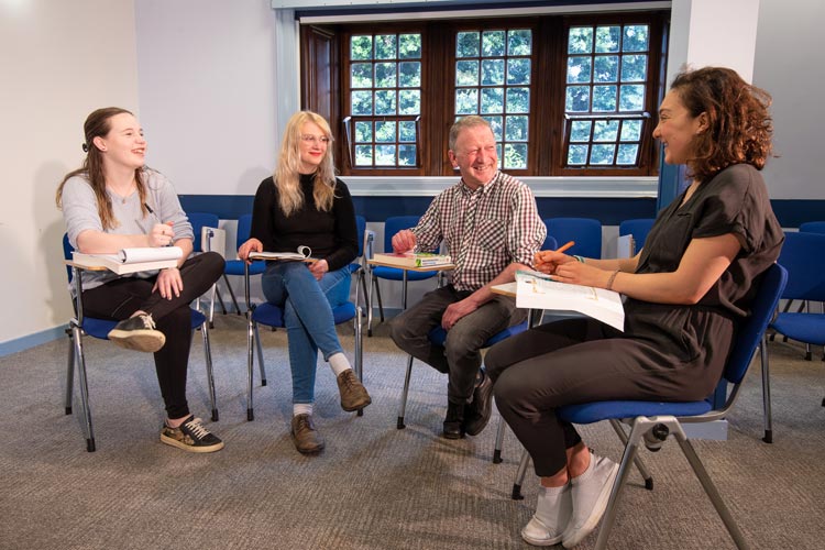 Illustrative photo of students and a staff member