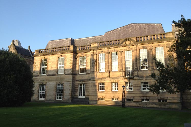 Evening photo of the front of the Psychology building.