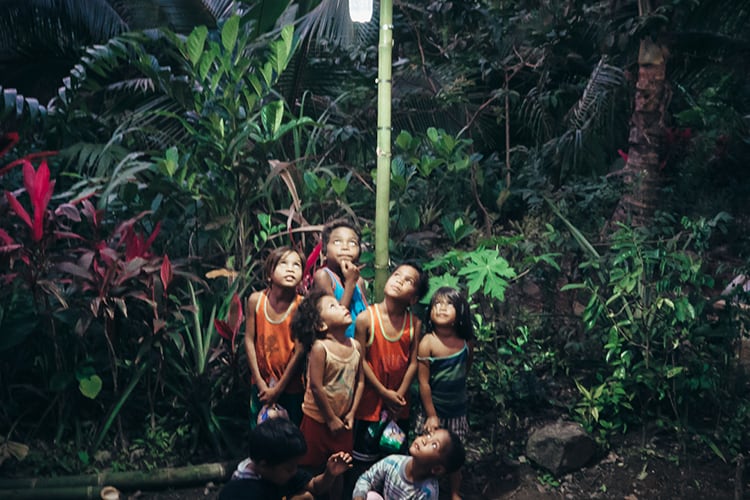 Children under a light