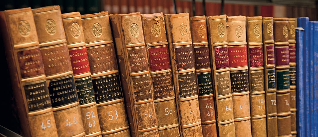 Old books stacked on a shelf