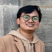 Haidir Faridha standing outside of the International Education Institute building