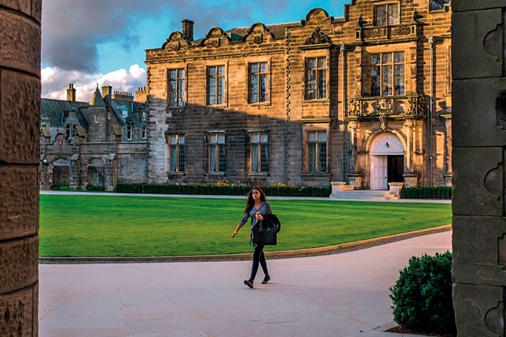 Student walking alone through St Salvator's Quadrangle