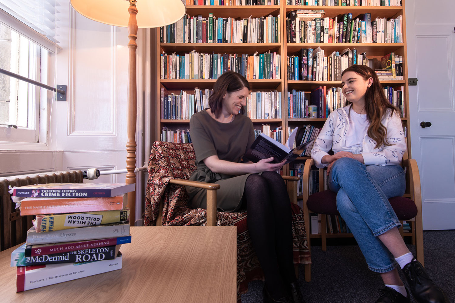 Two women in an office with books