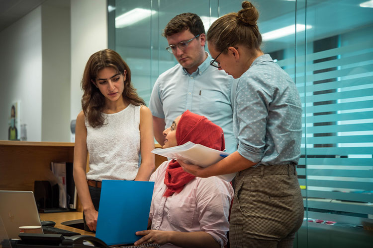 Medical students at a table discussing