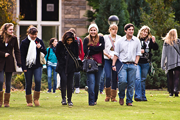 Students walking on the lawn in St Mary's Quad